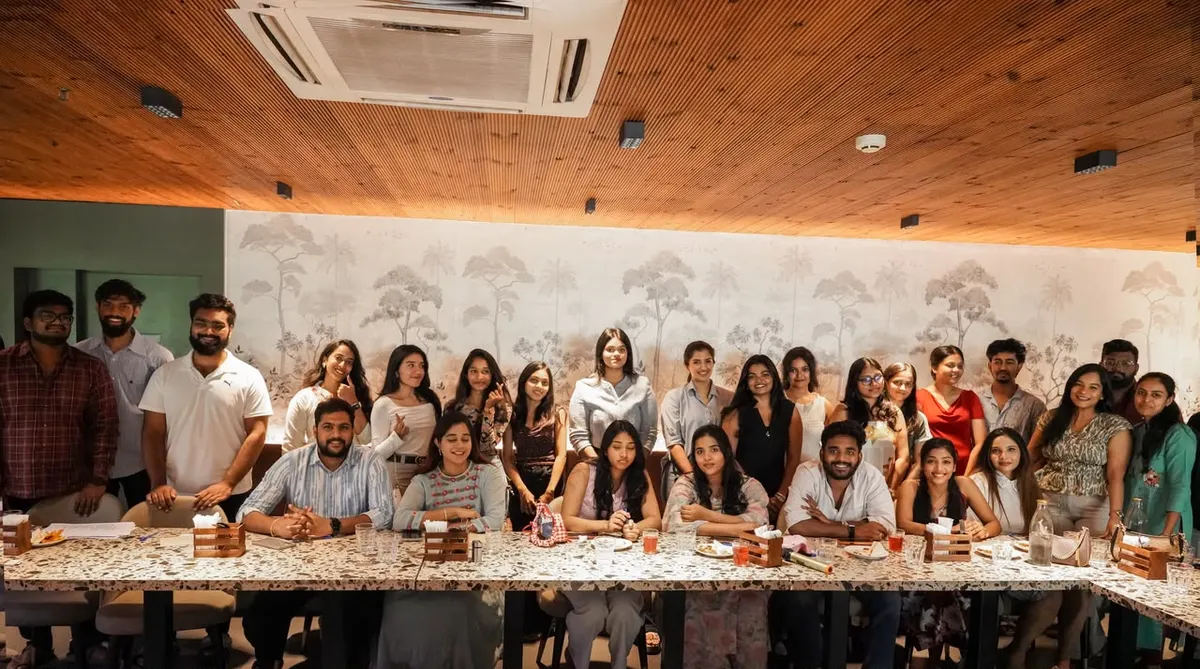 A large group at a founder dinner around a long table