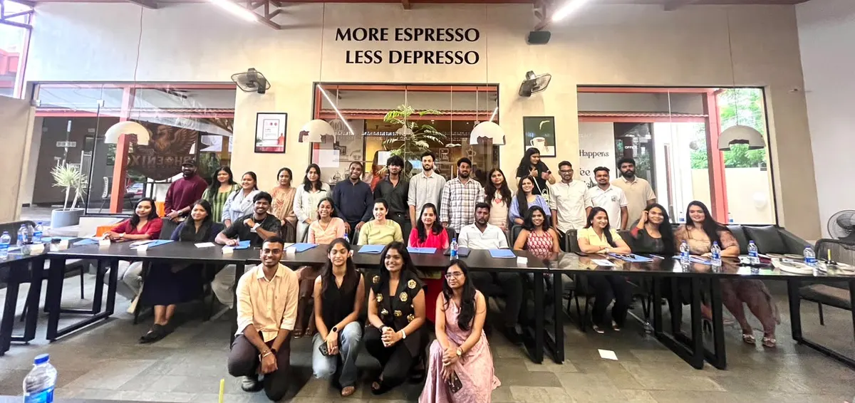 A community meetup group photo at a café